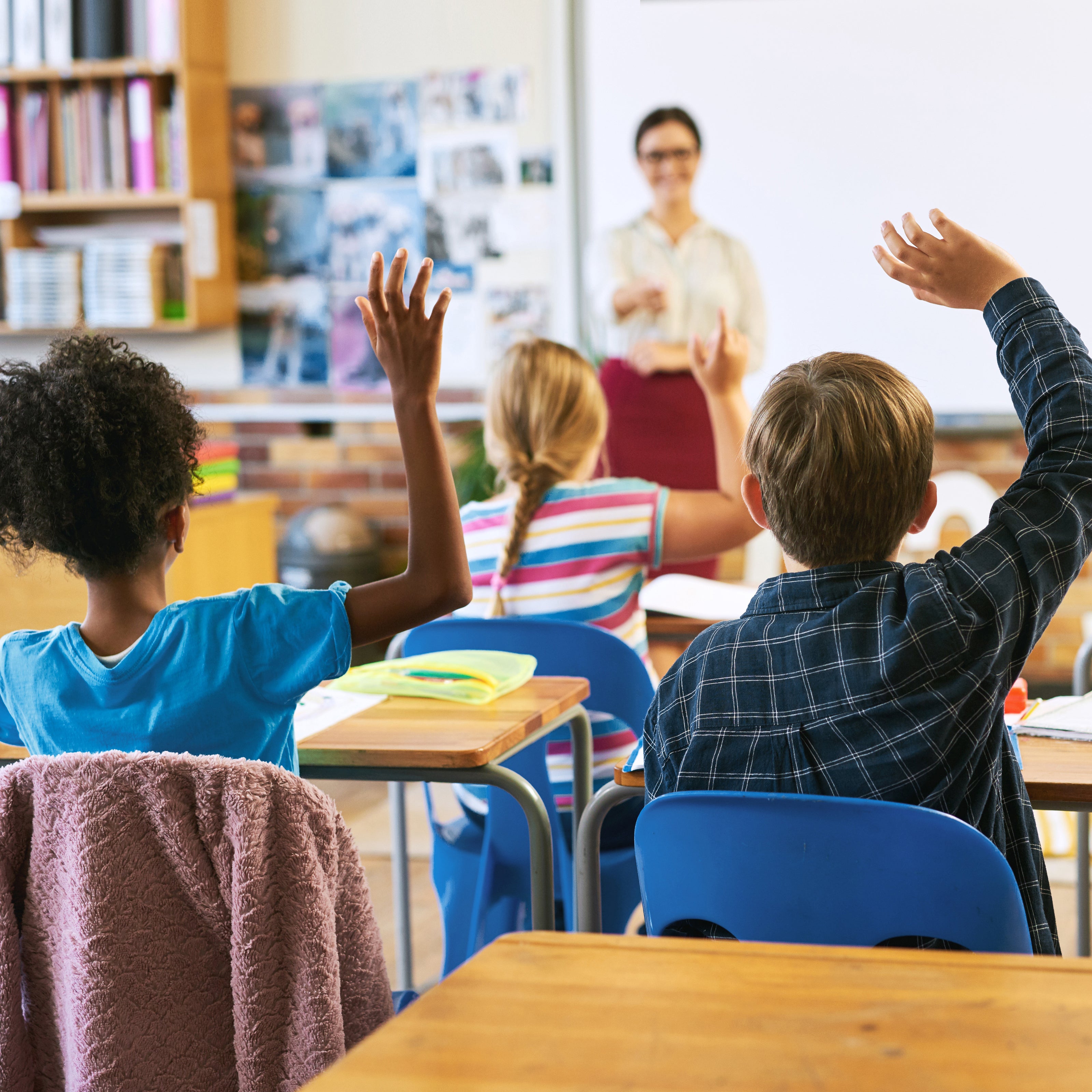 Children Raising Hands in Classroom | The Good and the Beautiful