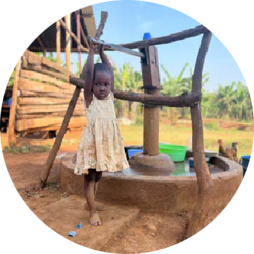 A photo of a little girl by a well | The Good and the Beautiful
