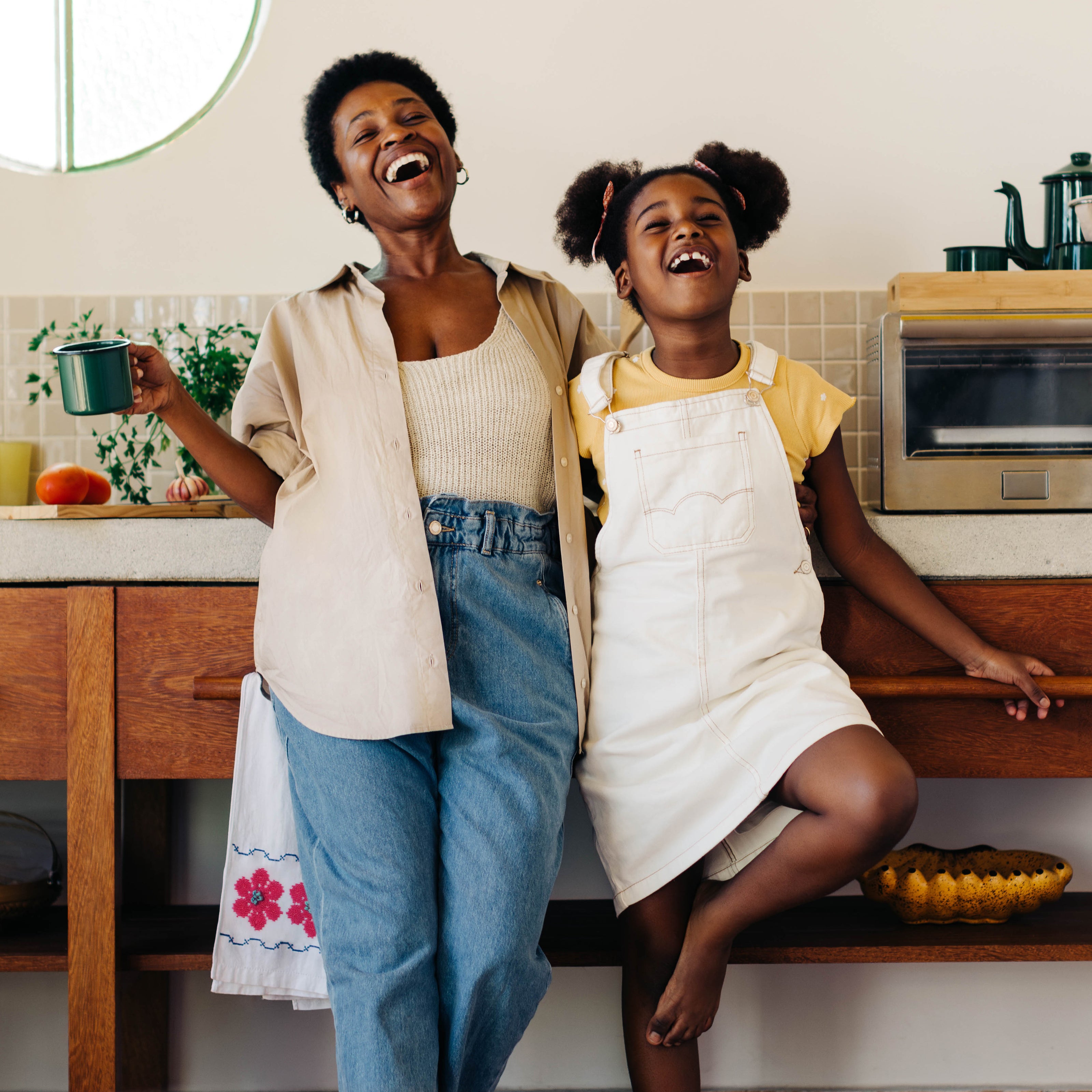 Mother and daughter laughing together | The Good and the Beautiful
