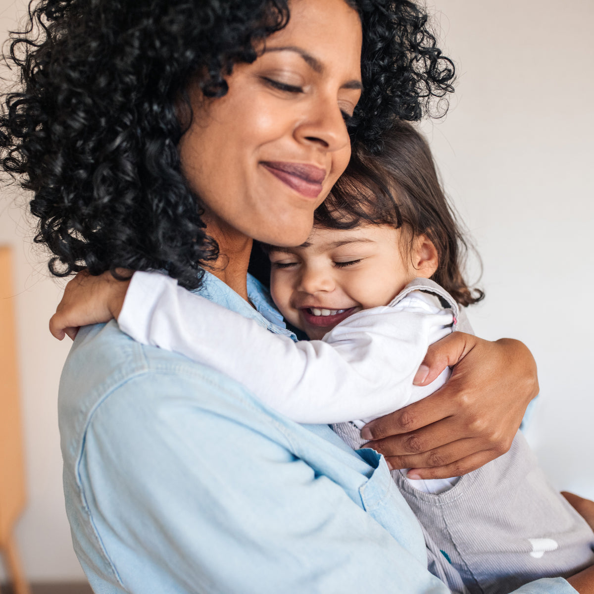 A young girl and her mom hugging | The Good and the Beautiful