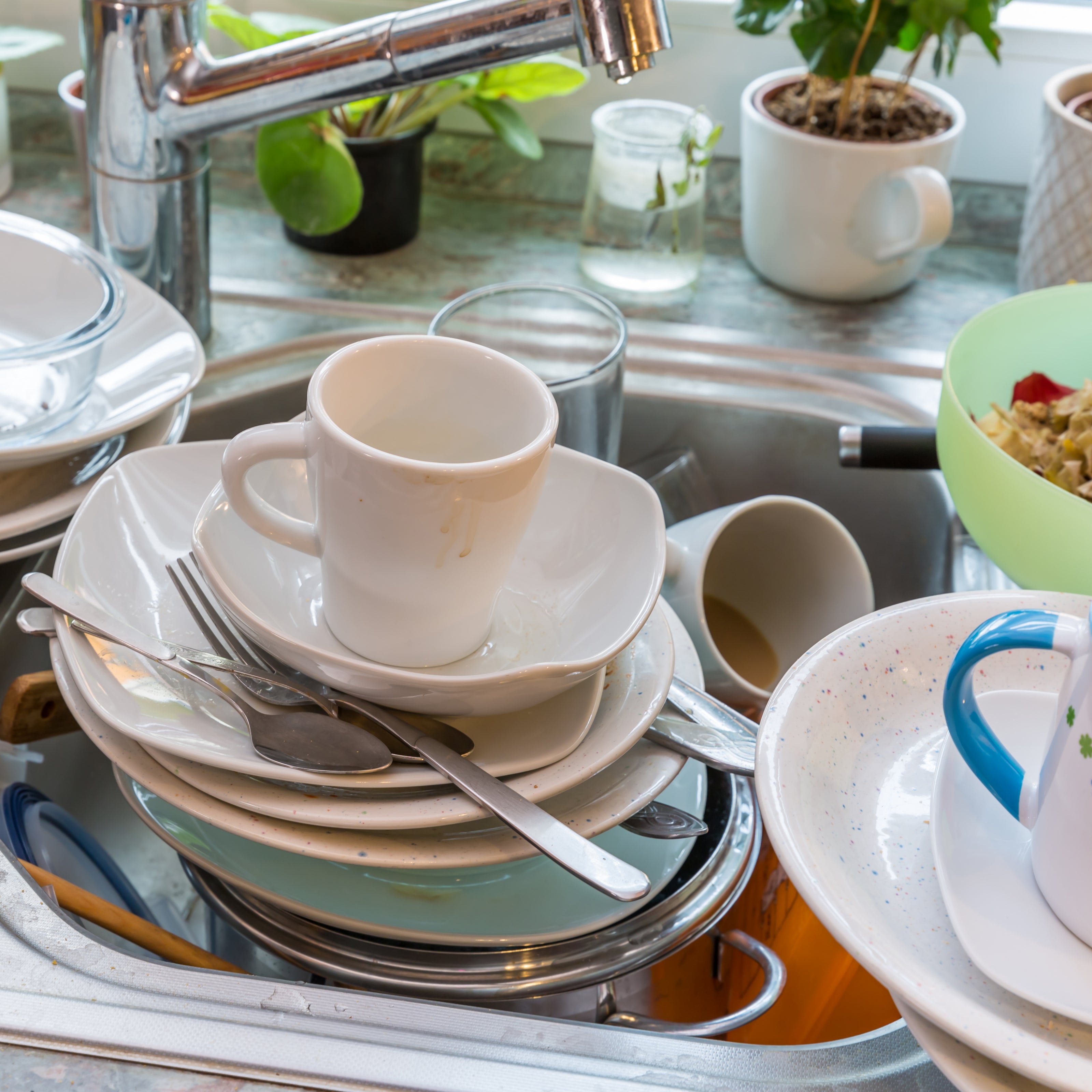 A kitchen sink full of dirty dishes | The Good and the Beautiful
