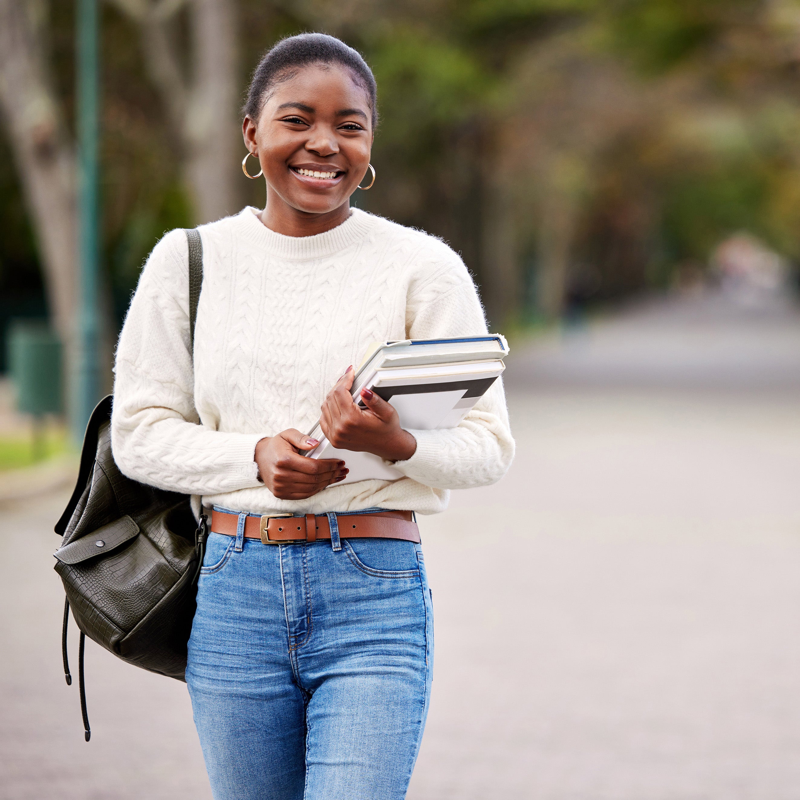 Young adult student on campus at college | The Good and the Beautiful