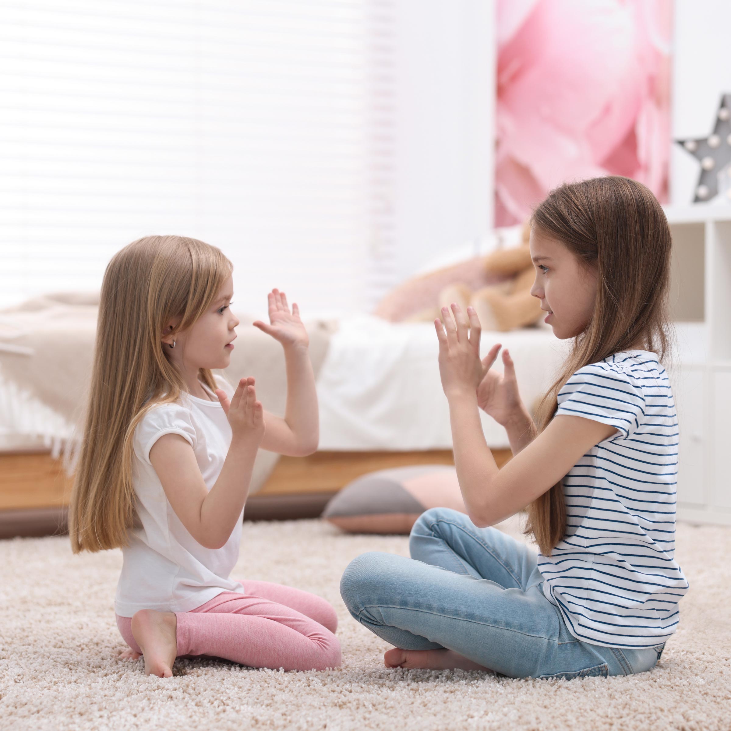 Children playing hand claps game
