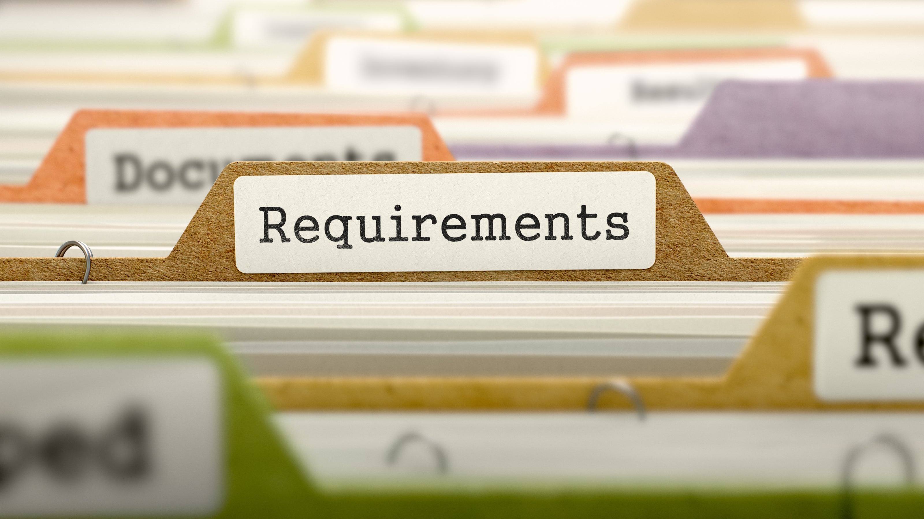 A full file folder with the label "Requirements" | The Good and the Beautiful