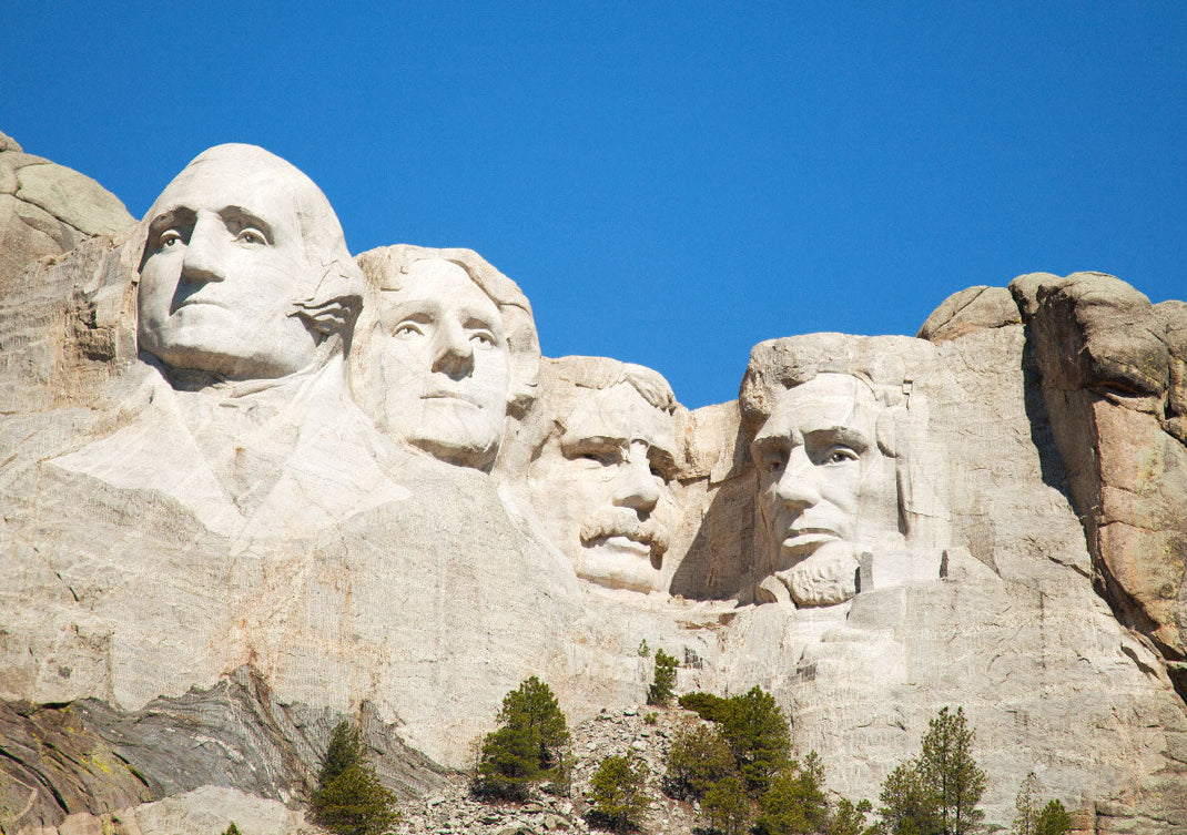 Mount Rushmore | Four U.S. Presidents: George Washington, Thomas Jefferson, Theodore Roosevelt, and Abraham Lincoln, symbolizing America's birth, growth, development, and preservation
