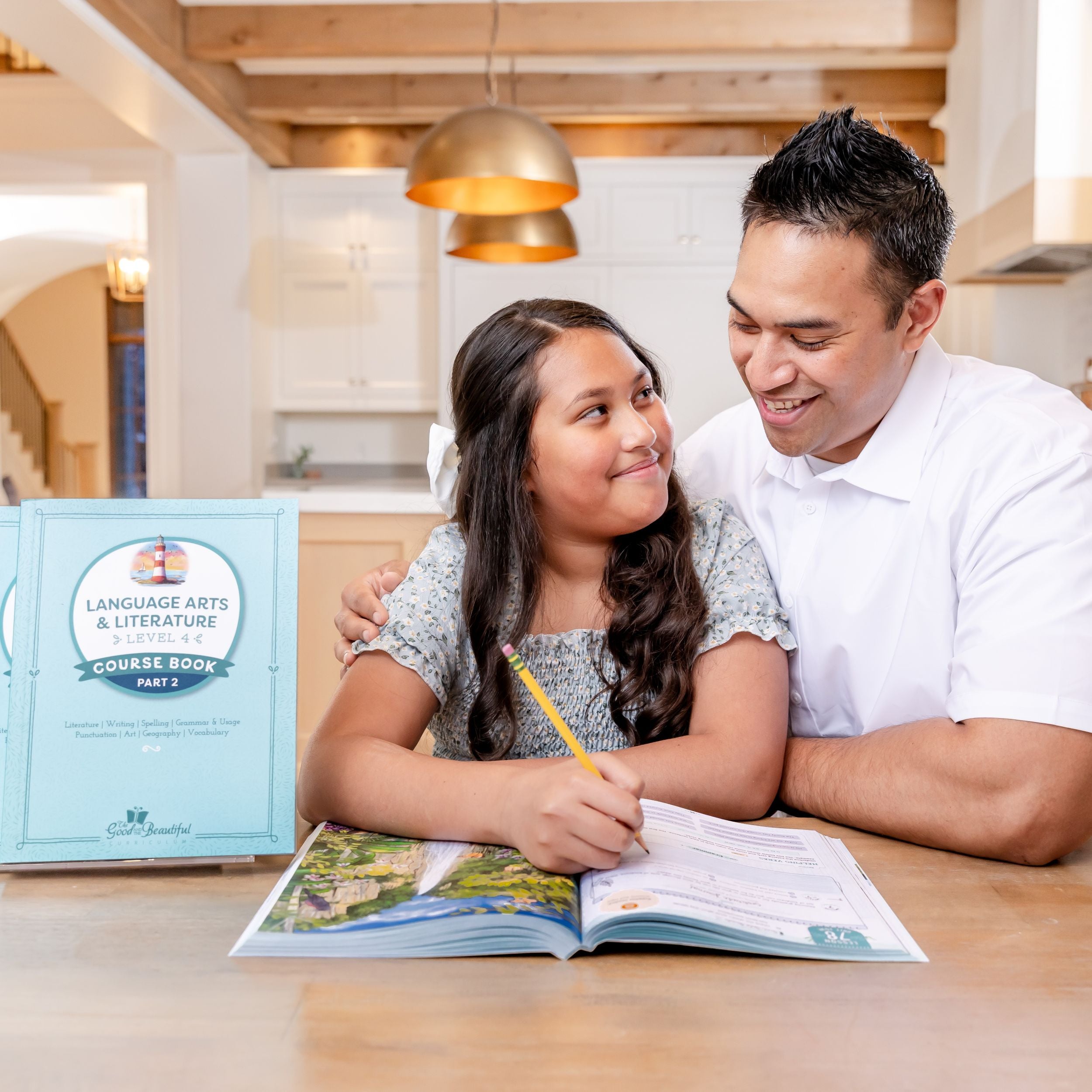 A father has his arm around his school-aged daughter as she writes in the language arts level 4 course book | The Good and the Beautiful