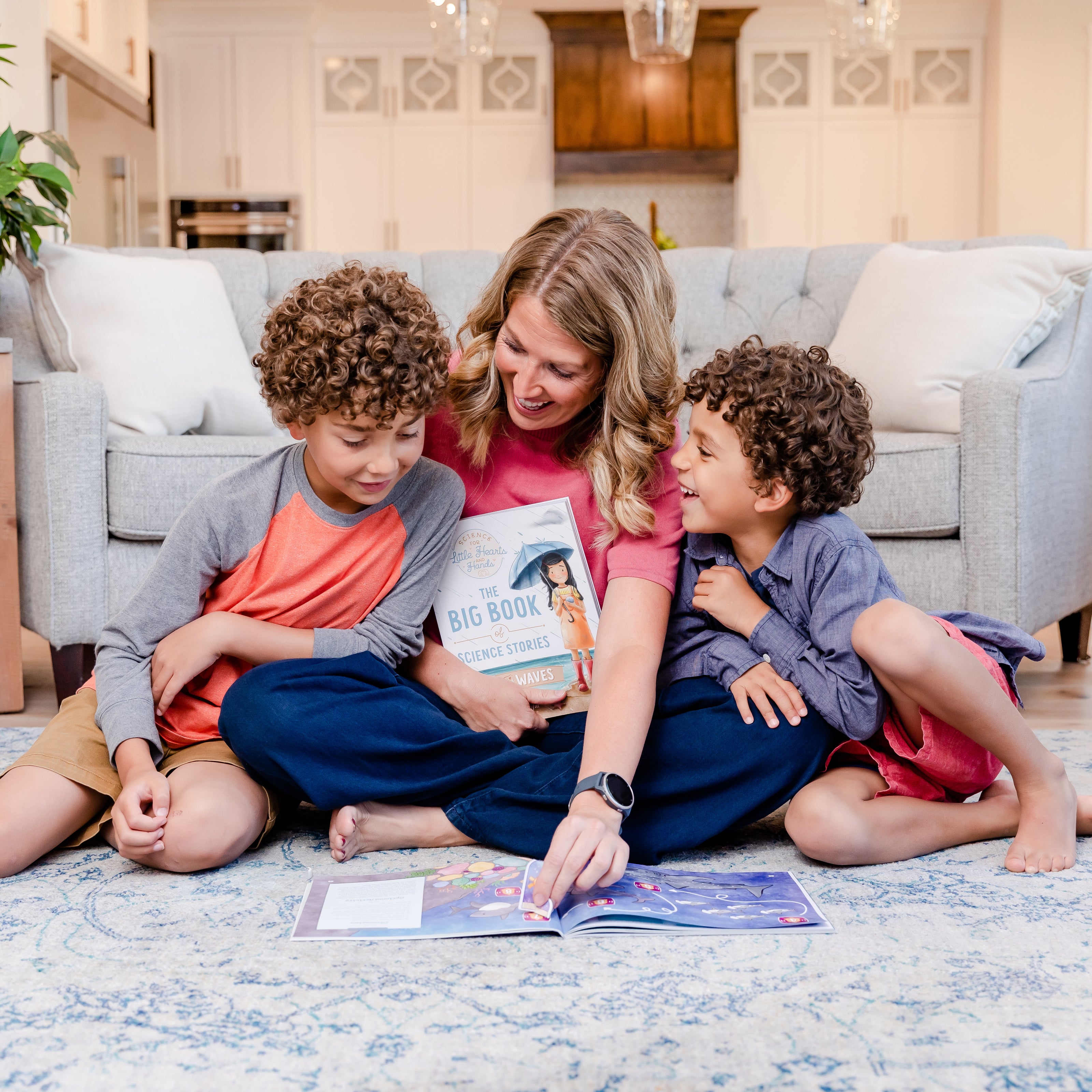 Two school-aged boys with their mom looking at the Wind and Waves science course for Little Hearts and Hands | The Good and the Beautiful