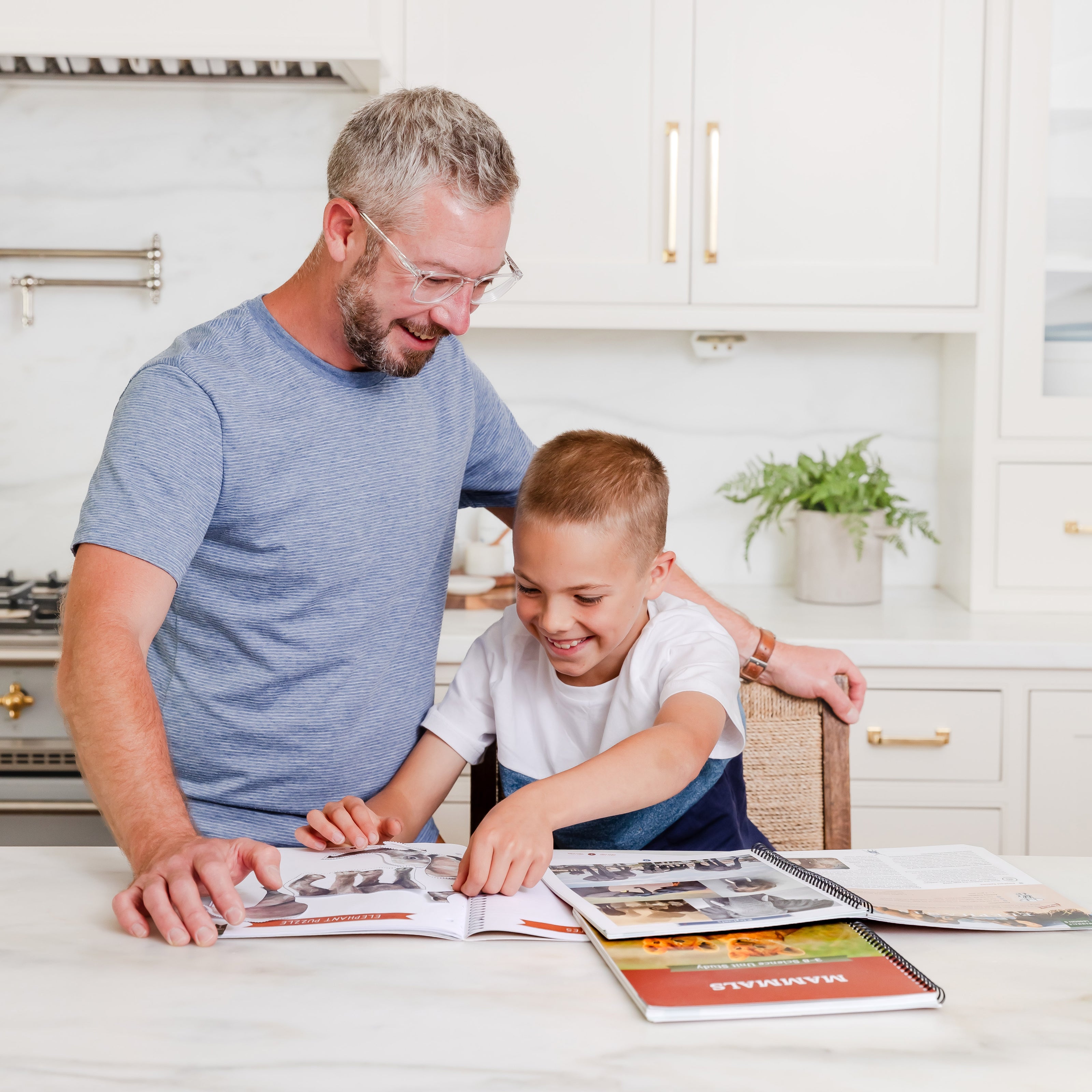 Young boy and father doing Mammals Science Unit Study | The Good and the Beautiful