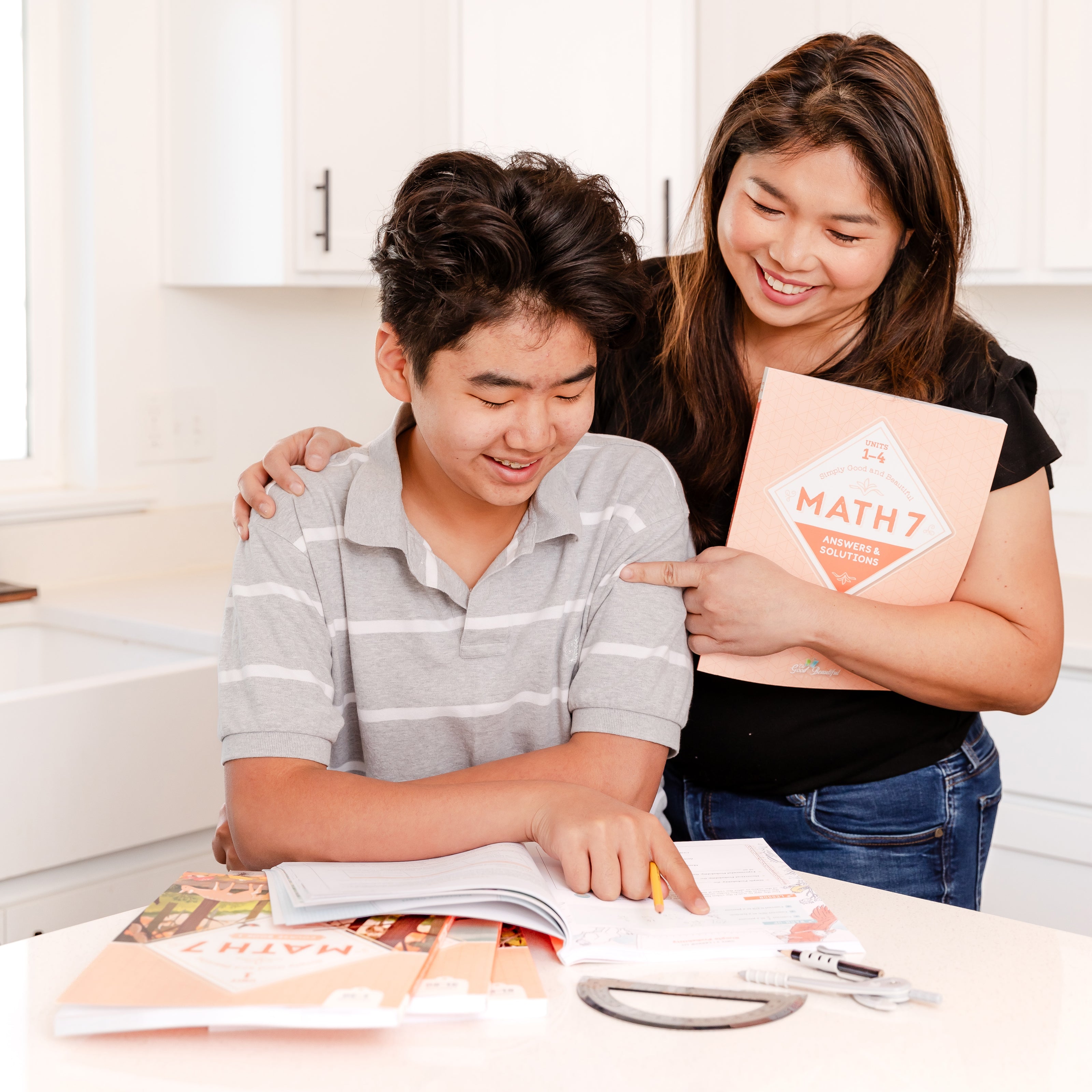 A school-aged boy with his mom working on Math level 7 | The Good and the Beautiful