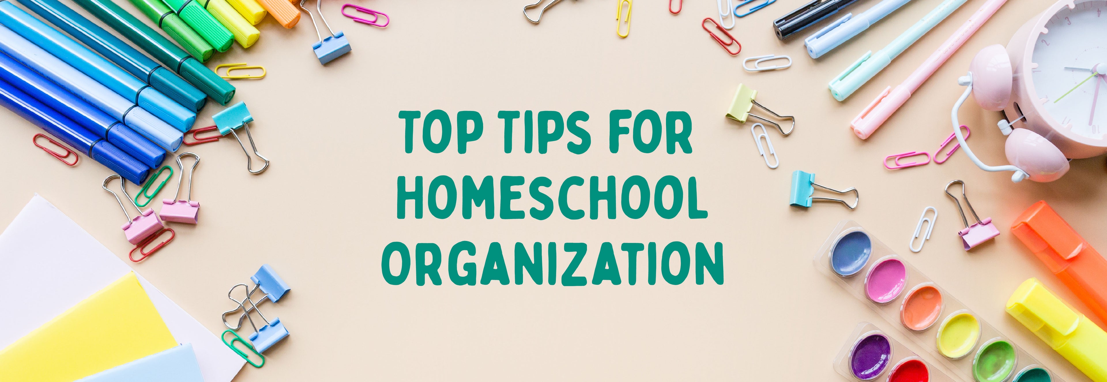School supplies laying out on a table with the text "Top Tips for Homeschool Organization" | The Good and the Beautiful