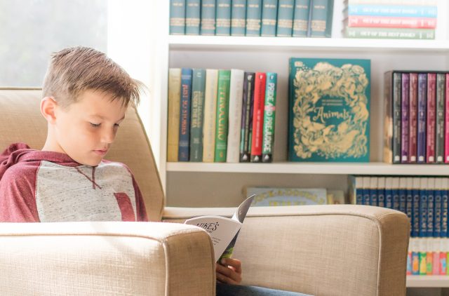 Photograph of Middle School Aged Boy Reading