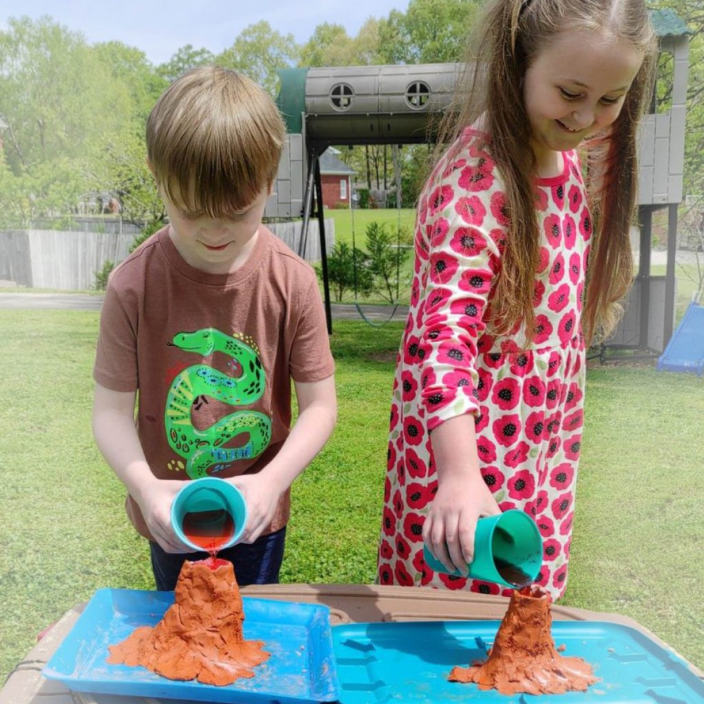 Photograph of two children and homemade volcano experiment