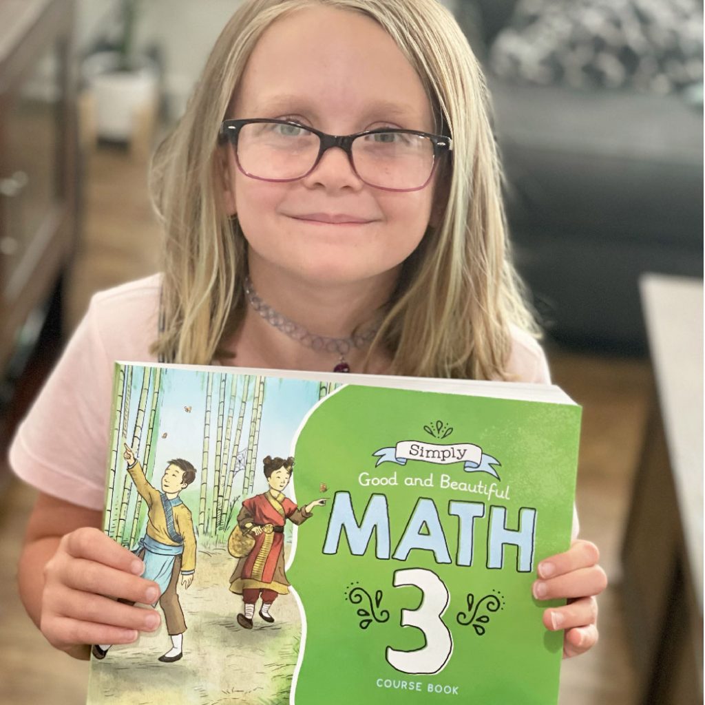 girl with math book