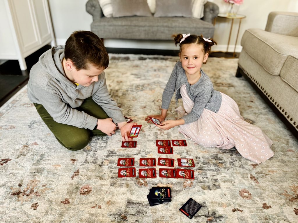 A girl and a boy playing Luke and Lily of the Lighthouse Game to learn compound words.