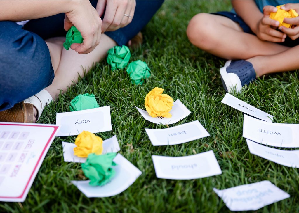 Photograph sight word game in the grass