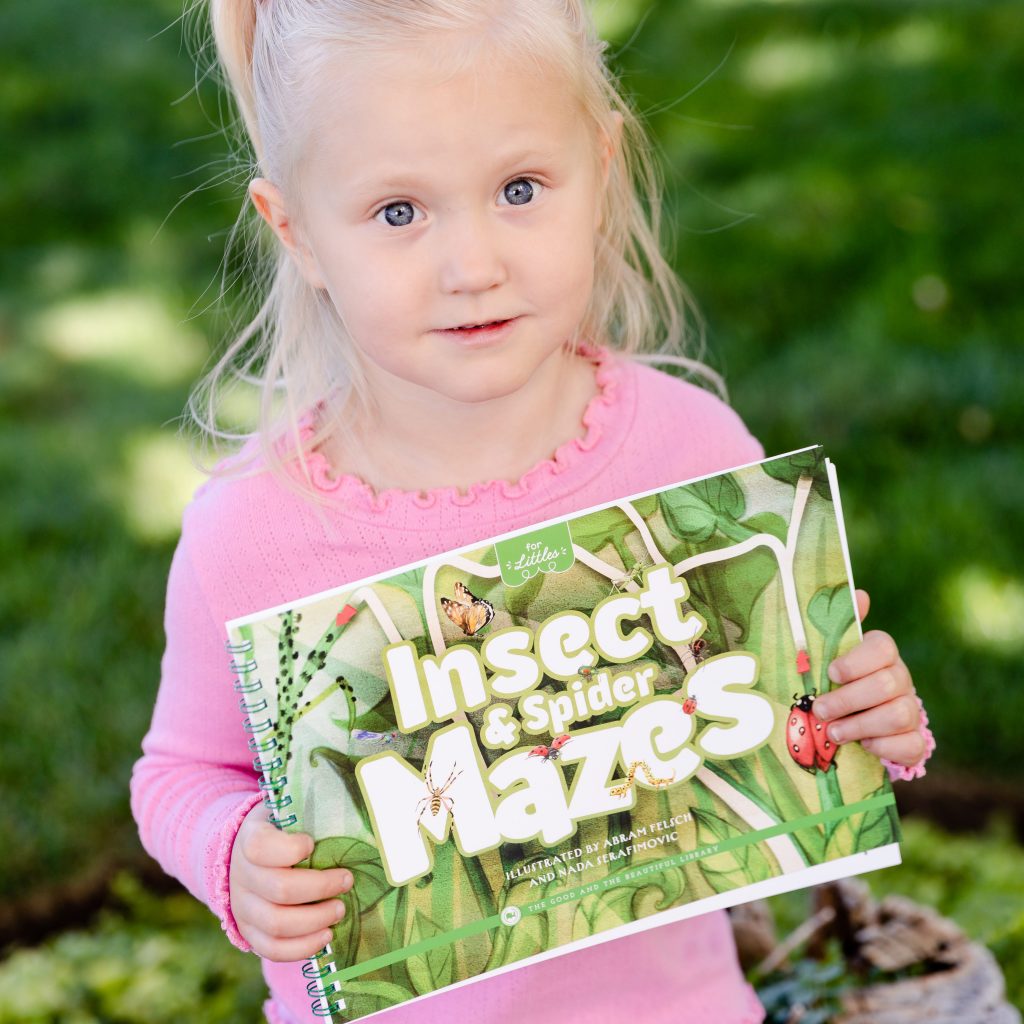 Photograph girl holding Insect and Spider Mazes