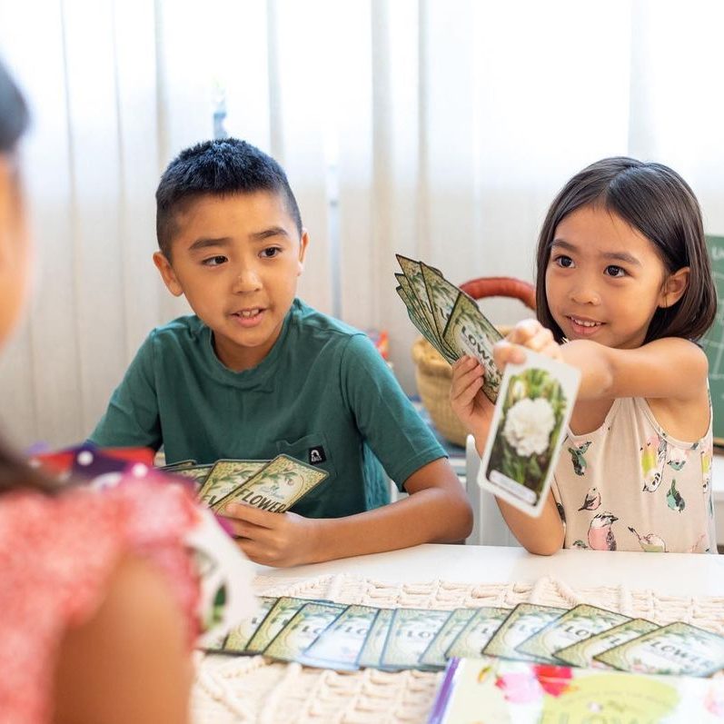 Photograph of kids playing the Flower Card Game