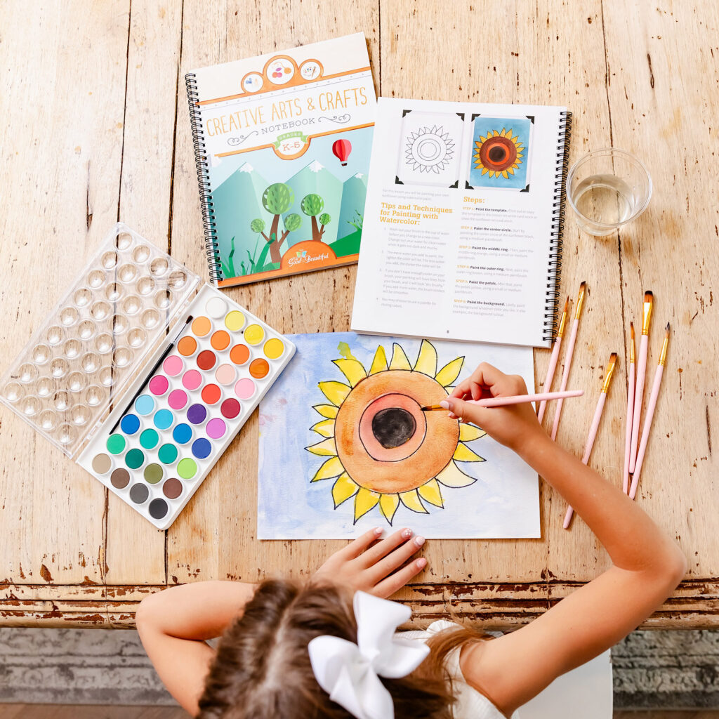 Photograph of Girl Using Creative Arts and Crafts Notebook
