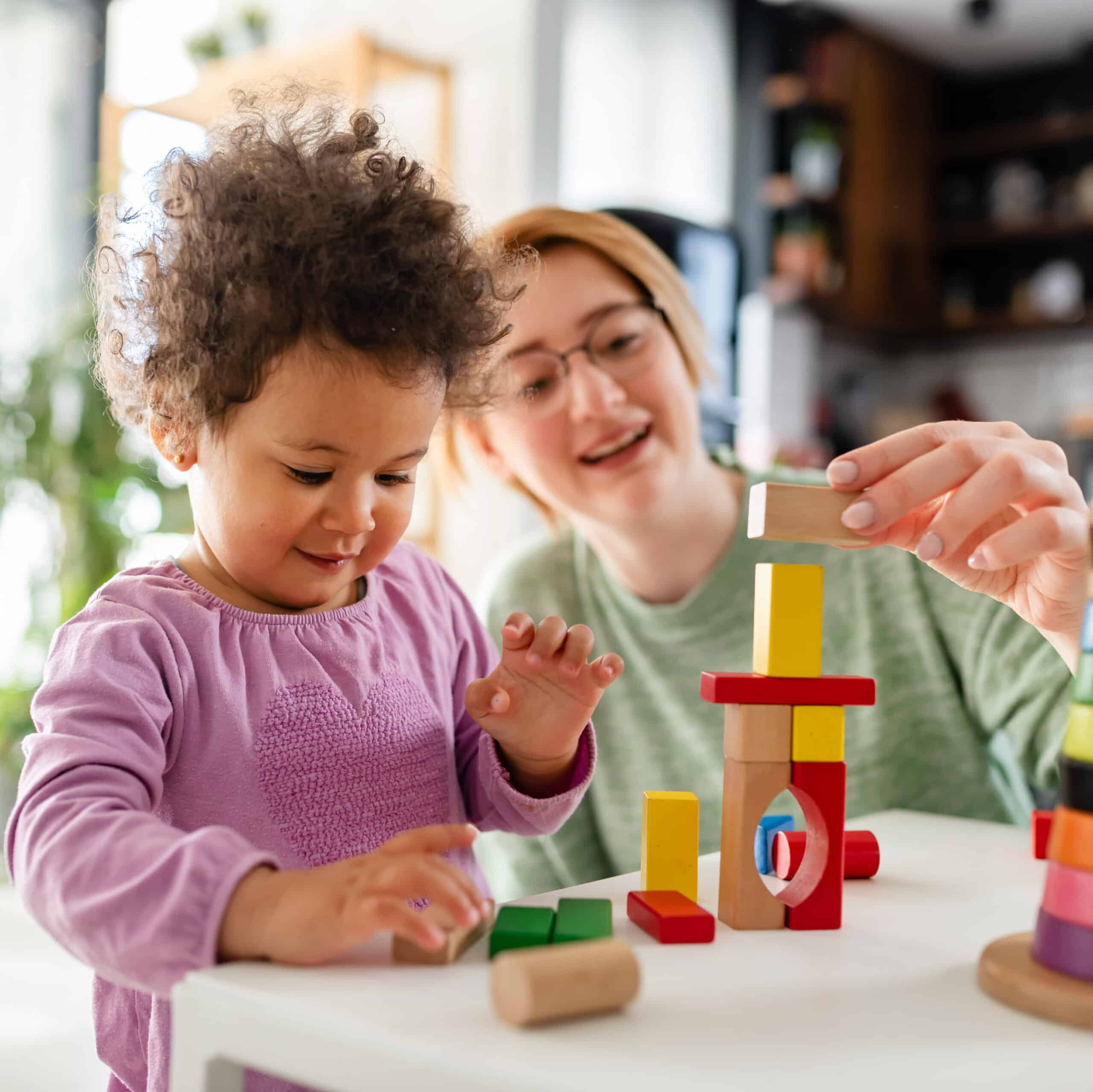 Photograph of Mother and Daughter Playing Blocks